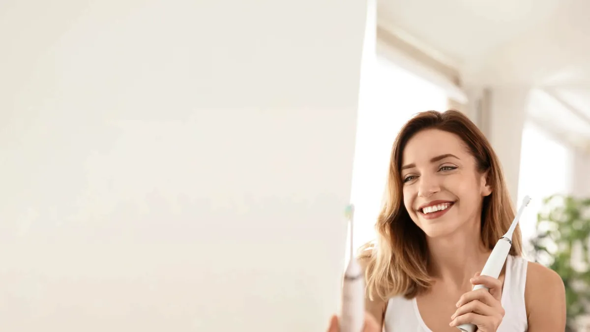 Elvin Levinler holding a toothbrush
