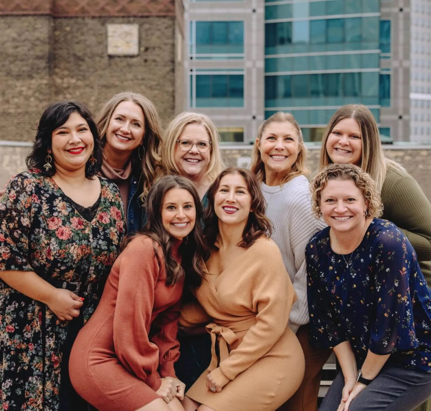 a group of women posing for a photo