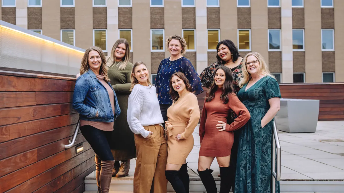 a group of women posing for a photo