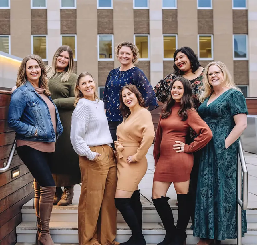 a group of women posing for a photo